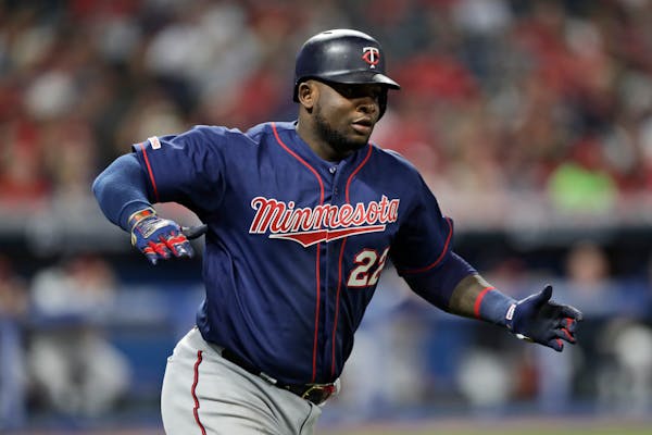 Miguel Sano reacts after hitting a grand slam in the eighth inning in the second baseball game of a doubleheader against the Indians