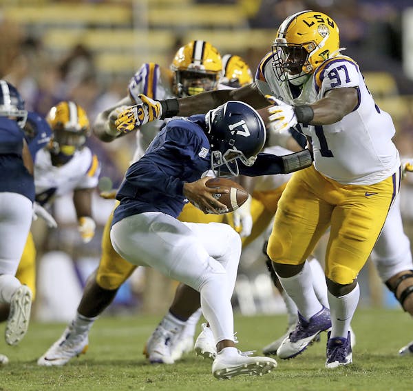 QB Justin Tomlin, shown playing Aug. 31 against LSU, was one of three Eagles to rush for 100 yards last week.