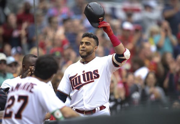The Twins' Nelson Cruz acknowledged the cheering crowd as he celebrated his 40th home run of the season, and his 400th career homer, a 412 foot solo s