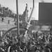 The goal posts at Metropolitan Stadium were tipped at precarious angle as happy Vikings fans worked to bring them down following their 27-7 victory ov