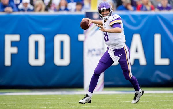 Vikings quarterback Kirk Cousins ran out of the pocket in the first quarter.