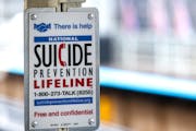 A suicide prevention sign in a subway station in Chicago. (Beatrice Preve/Dreamstime/TNS) ORG XMIT: 1342454