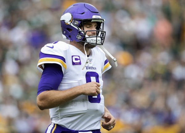 Minnesota Vikings quarterback Kirk Cousins (8) walked back to the sidelines after throwing an interception in the end zone during the fourth quarter.