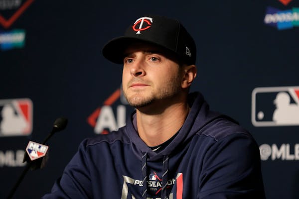 Twins starting pitcher Jake Odorizzi talks to reporters during a news conference during the ALDS.