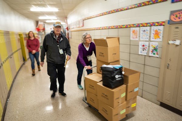 Volunteers with The Sheridan Story distributed meals at a south Minneapolis elementary school. The Sheridan Story received a revolving credit line fro