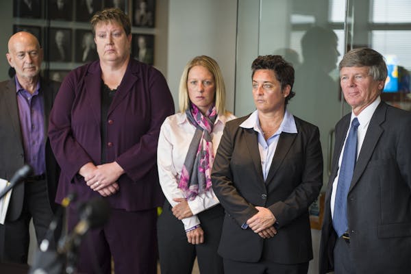 FILE - Former UMD women’s basketball coach Annette Wiles, softball coach Jen Banford, and hockey coach Shannon Miller announce a lawsuit against the