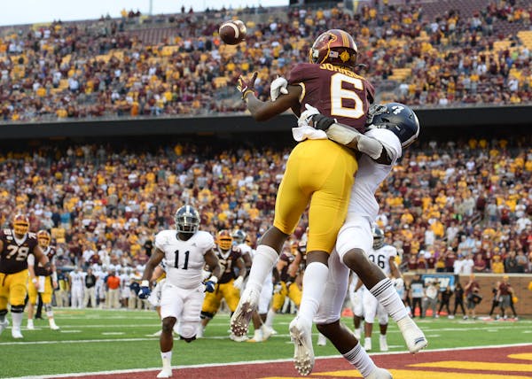 Gophers wide receiver Tyler Johnson pulled down a touchdown catch to put the Gophers back in the lead with 13 seconds left in the fourth quarter as he