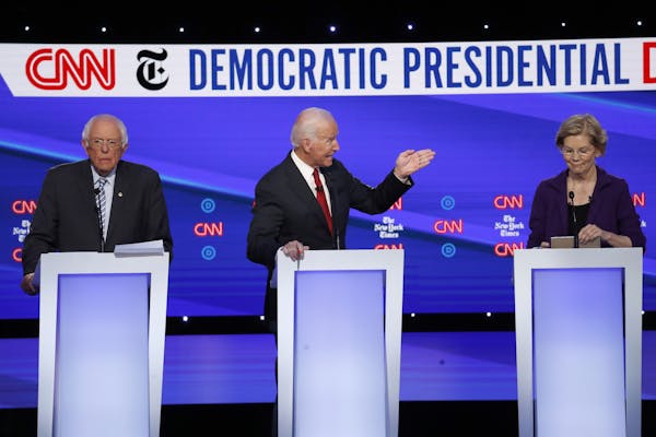 Democratic presidential candidate Sen. Bernie Sanders, I-Vt., left, former Vice President Joe Biden, center, and Sen. Elizabeth Warren, D-Mass., parti