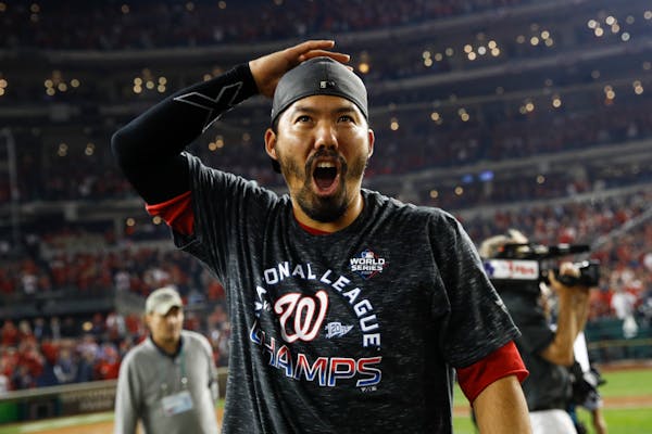 Former Twins and now Nationals catcher Kurt Suzuki whooped it up after Washington beat St. Louis 7-4 on Tuesday night to win the National League Champ