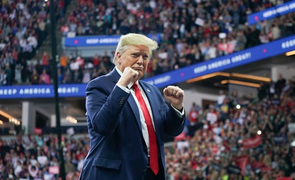 President Donald Trump adopted a combative stance as he greeted thousands of cheering supporters at Target Center in Minneapolis on Thursday night.