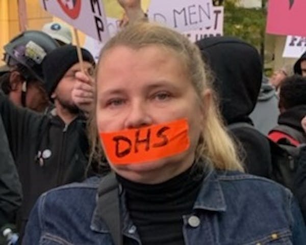 DHS compliance officer Faye Bernstein protested against mistreatment of whistleblowers outside of a rally for President Donald Trump in Minneapolis.