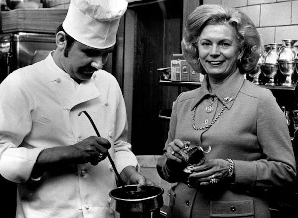 In the kitchen at Charlie’s Cafe Exceptionale in Minneapolis with executive chef George Lisovskis and owner Louise Saunders in 1976.