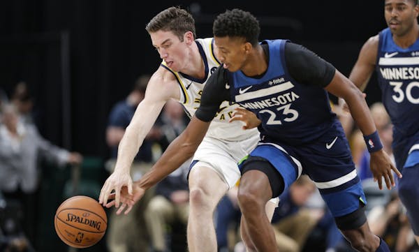 Wolves rookie Jarrett Culver challenged the Pacers’ T.J. Leaf for the ball during the second half Tuesday in Indianapolis.