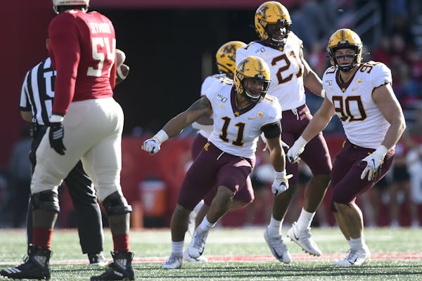 Gophers safety Antoine Winfield Jr. (11) celebrated after intercepting a first-quarter pass from Rutgers quarterback Johnny Langan on Saturday.