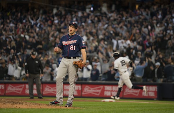 Twin reliever Tyler Duffey reacted after New York Yankees shortstop Didi Gregorius, rear, knocked a grand slam home run in the third inning.