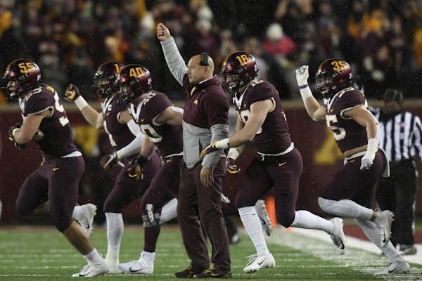 Gophers head coach P.J. Fleck signaled to his team in the first half.