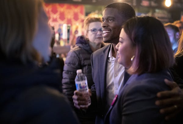 St. Paul Mayor Melvin Carter joined those at Black Hart of St. Paul celebrating as the yes forces won in the vote of the city's trash-collection syste