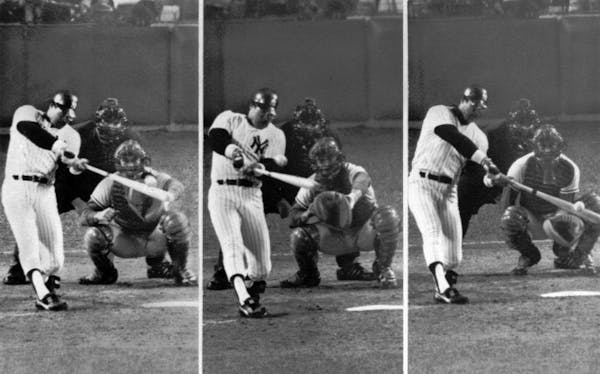 New York Yankees' Reggie Jackson connects for three home runs in Game 6 of the World Series at Yankee Stadium in New York.