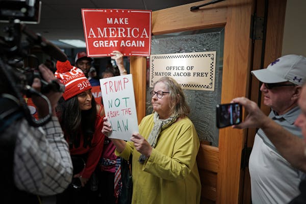 A group of about 30 pro Trump supporters gathered for a rallying at noon Wednesday outside Mayor Jacob Frey's office in City Hall, to show "how disple