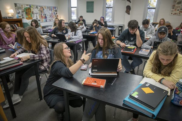 In White Bear Lake, district officials expect a surge of 2,000 more students over the next decade. Above, Katelin Held worked with her language arts s