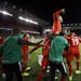 Canada midfielder Scott Arfield, top, and teammates celebrate a goal by forward Lucas Cavallini (19) in a CONCACAF Nations League soccer match against