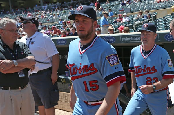 Glen Perkins and Tom Brunansky donned the throwback baby blues during a Twins game in 2014.