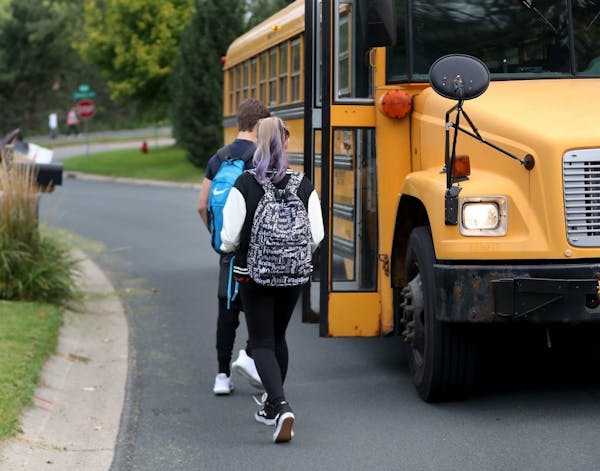 Students in Eden Prairie walked to board a school bus nicknamed "the secret bus," to attend class in the Minnetonka district in 2017.