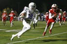SMB�s Sanjay Redd (19) sprints down the sideline on an 11-yard first quarter TD run against Benilde-St. Margaret�s Friday night. The Wolfpack trai