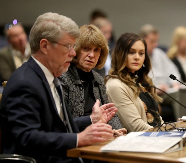 Jodi Harpstead, center, Minnesota Department of Human Services Commissioner (DHS), appeared before a Senate committee about the agency making $29 mill