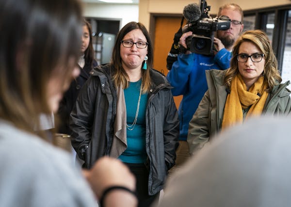 Minnesota Lt. Gov. Peggy Flanagan, right, and Rep. Jamie Becker-Finn, DFL-Roseville, listened to prisoners’ stories about being separated from their