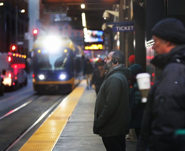 Commuters wait for a light rail train at the Nicollet Mall station in downtown Minneapolis on Nov. 7.