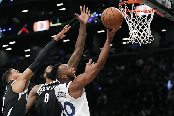 Nets center DeAndre Jordan defended against second-year Wolves guard Josh Okogie on a shot during the first half of Wednesday night’s season opener 