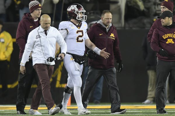 Gophers coach P.J. Fleck and quarterback Tanner Morgan walked off the field after Morgan was injured on the final drive of last Saturday’s loss at I