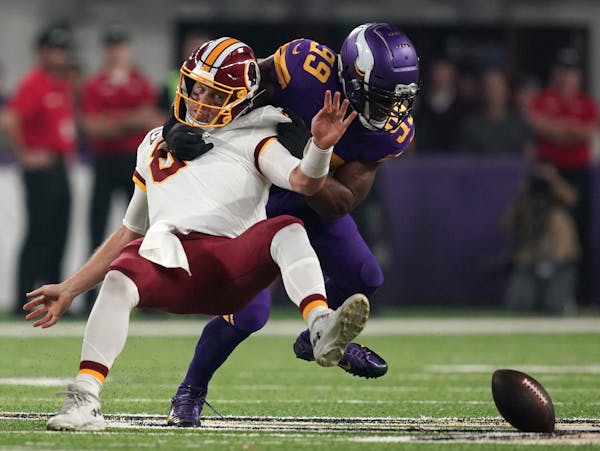 Vikings defensive end Danielle Hunter separated Redskins quarterback Case Keenum from the football during the first quarter at U.S. Bank Stadium on Th