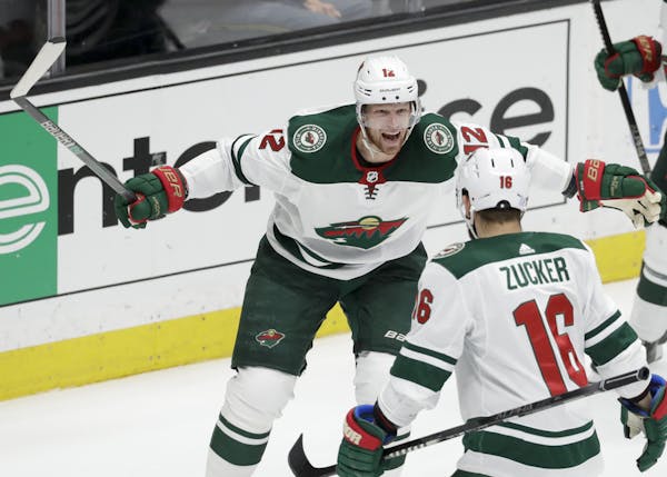 Wild center Eric Staal, left, celebrated with left wing Jason Zucker after scoring against the Ducks in the third period Tuesday.