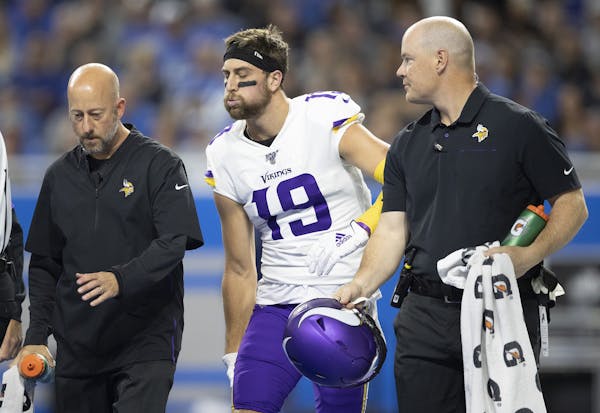 Vikings wide receiver Adam Thielen held his right hamstring as he walked of the field at Detroit on Oct. 20