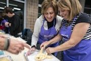 Joanie Rischall, from right, of Plymouth helped first time challah maker Nancy Lehrman, of Plymouth braid her dough during the Great Big Challah Bake.