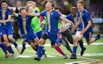 Noah Hermanson (3) of Holy Angels dashed across the field with teammates after scoring the the winning goal in double over time. Holy Angels beat Blak