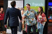 Mark Cuban congratulates Scott and Gina Davis after agreeing to invest $250,000 in their company, Dog Threads, in return for a 25% stake.
