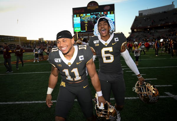 Gophers defensive backs Antoine Winfield Jr. (11) and Chris Williamson were jubilant following their 52-10 victory over Maryland.