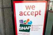 A sign indicates a store that accepts the Supplemental Nutritional Assistance Program or SNAP, the official name of the food stamp program.