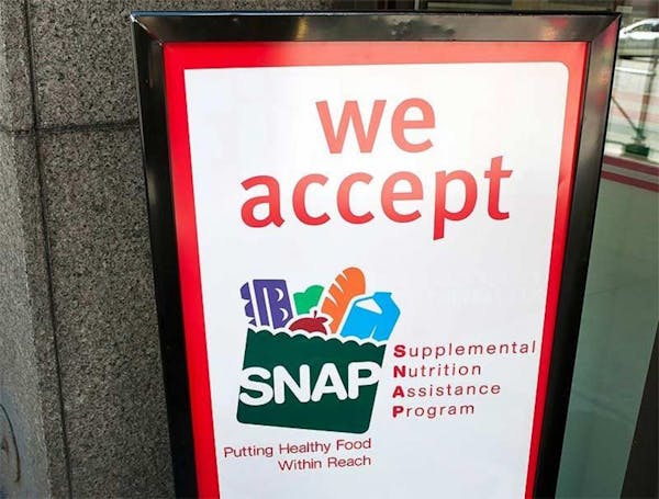 A sign indicates a store that accepts the Supplemental Nutritional Assistance Program or SNAP, the official name of the food stamp program.