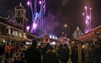 A crowd watched holiday lights come on as fireworks lit up the sky during the Plaza Lighting Ceremony in Kansas City on Nov. 28.