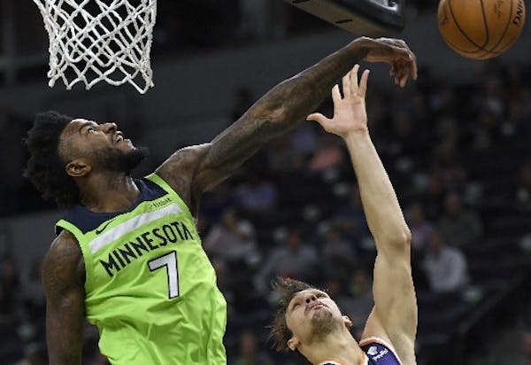 Jordan Bell swatted away a shot by former Timberwolf Dario Saric, one of his two blocks Saturday against Phoenix. Bell also had three points and nine 