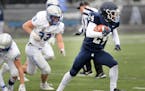 St. Thomas Academy running back Love Adebayo (24) is one of the keys to the Cadets’ offense in the Class 5A game against high-scoring Elk River. Pho