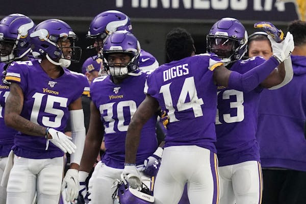 Minnesota Vikings running back Dalvin Cook (33) was congratulated by Minnesota Vikings wide receiver Stefon Diggs (14) after he scored a touchdown lat