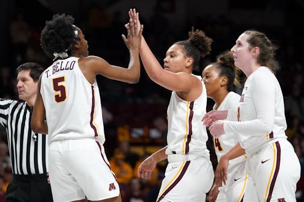 Gophers forward Taiye Bello gave a high five to guard Destiny Pitts during a game last month at Williams Arena. The Gophers won on the road Sunday.