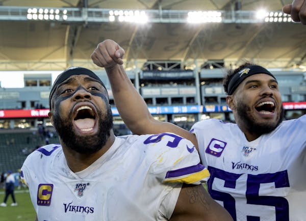 Vikings players Everson Griffen and Anthony Barr celebrated at the end of Sunday's victory over the Chargers in Carson, Calif.