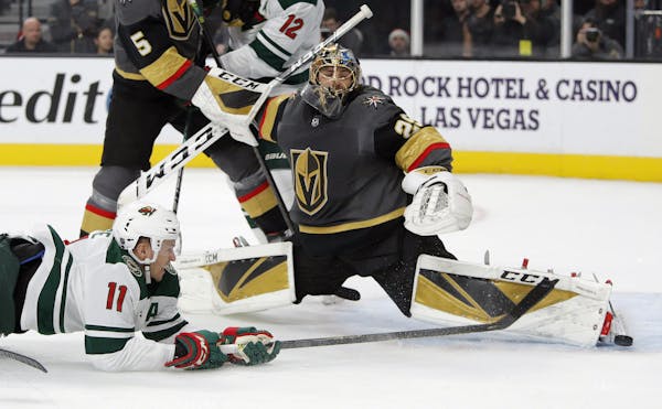 Golden Knights goaltender Marc-Andre Fleury blocked a shot by Wild left winger Zach Parise during the first period Tuesday. Parise scored in the final