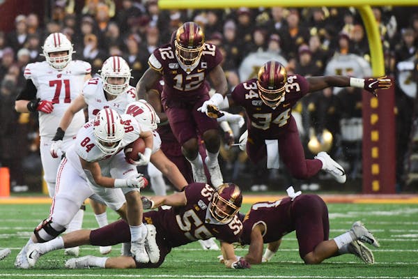 After Wisconsin beat Minnesota 38-17 on Saturday, the Badgers jumped up four spots in the College Football Playoff rankings to No. 8 and the Gophers f